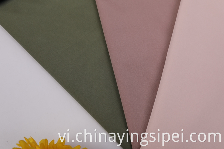 Sản phẩm mới Solid Plain Polyester Fabric Giá vải bông cho hàng may mặc